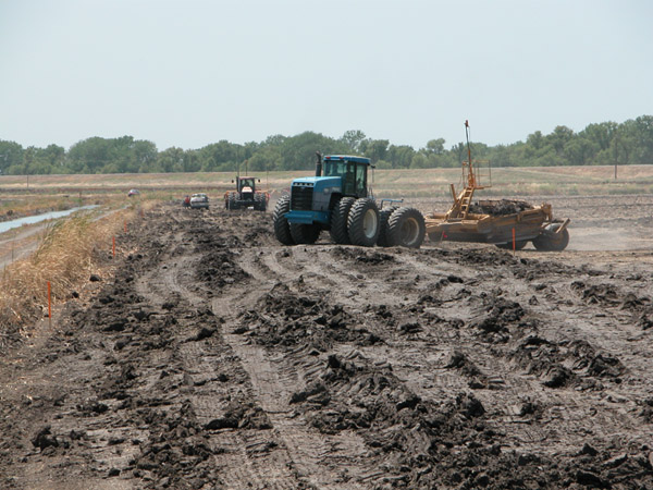 machinery in action at in an open dirt area of TNBC