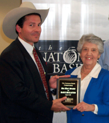 Founding Board Chair Anne Rudin presenting the Big Hat Award to 2002 winner David Bugatto