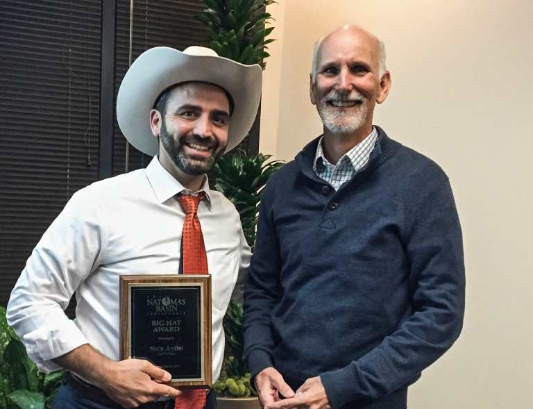 Nick Advis receives the 2015 Big Hat Award from Conservancy Board Secretary David Christophel